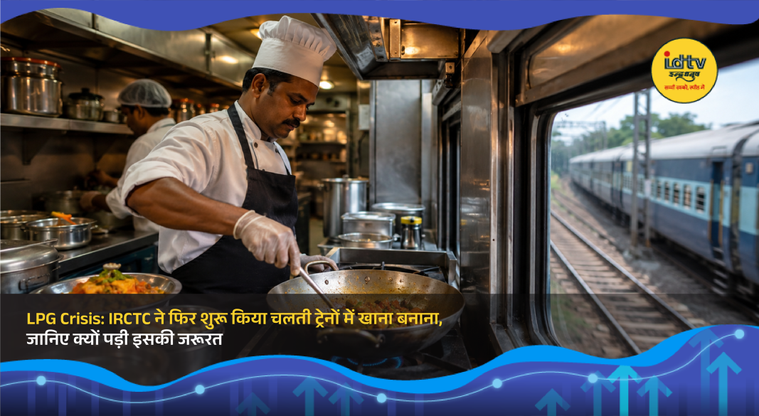 IRCTC staff preparing meals inside a train pantry car using electric induction cooktops.